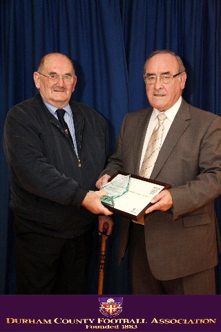 League President Derek Overton receives the League's Charter Standard Award from Durham F.A President Frank Pattison.